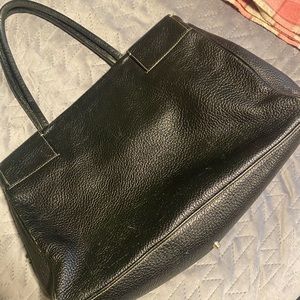 Well used Prada bag